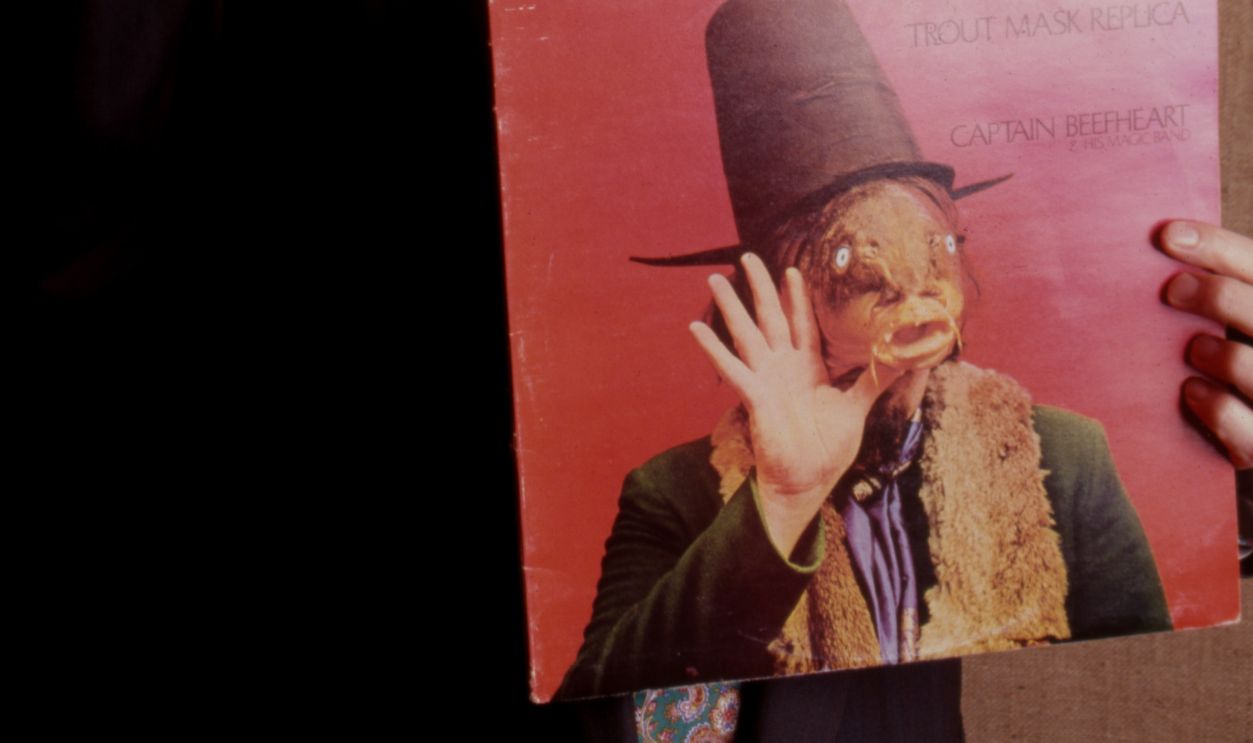 Andy Partridge (guitars, vocals) of English rock band XTC, portrait, holding up a copy of Captain Beefheart's Trout Mask Replica album, 2000.