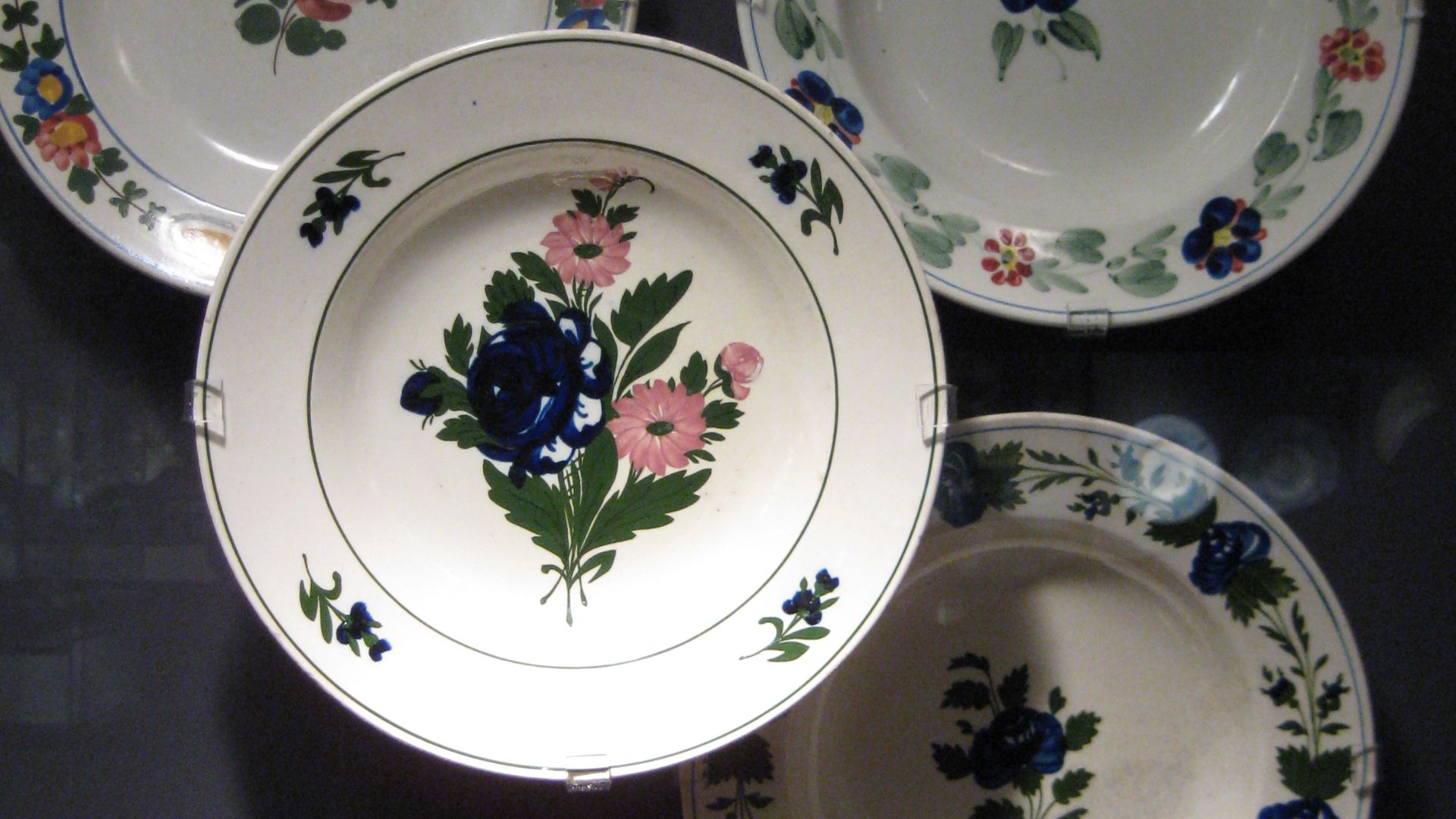 This is a set of decorated late 19th century Hungarian plates. Originally from Murany, Hungary, they are now part of the Koerner European Ceramic Gallery in UBC's Museum of Anthropology in Vancouver, Canada.