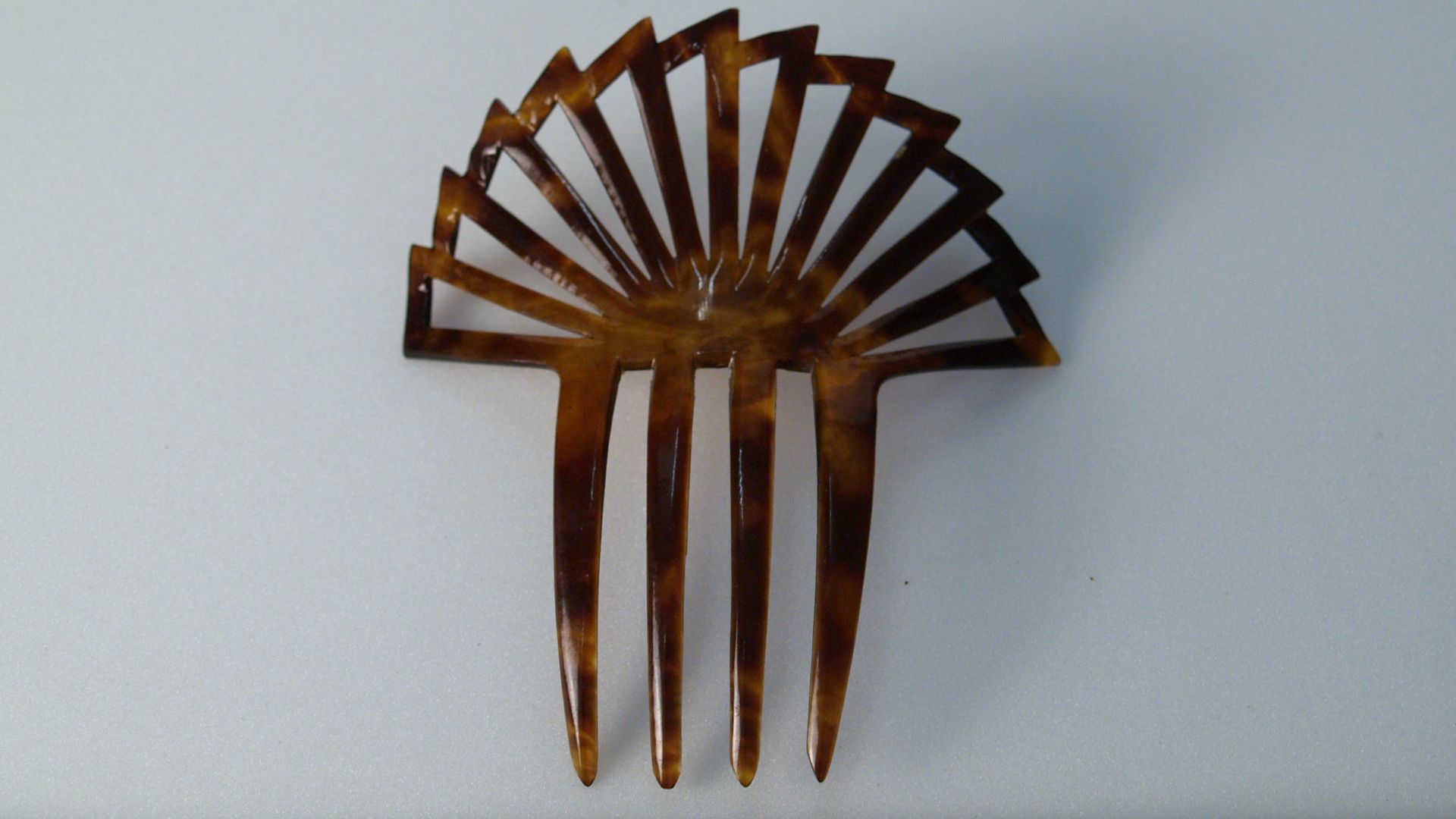 Two celluloid hair combs,