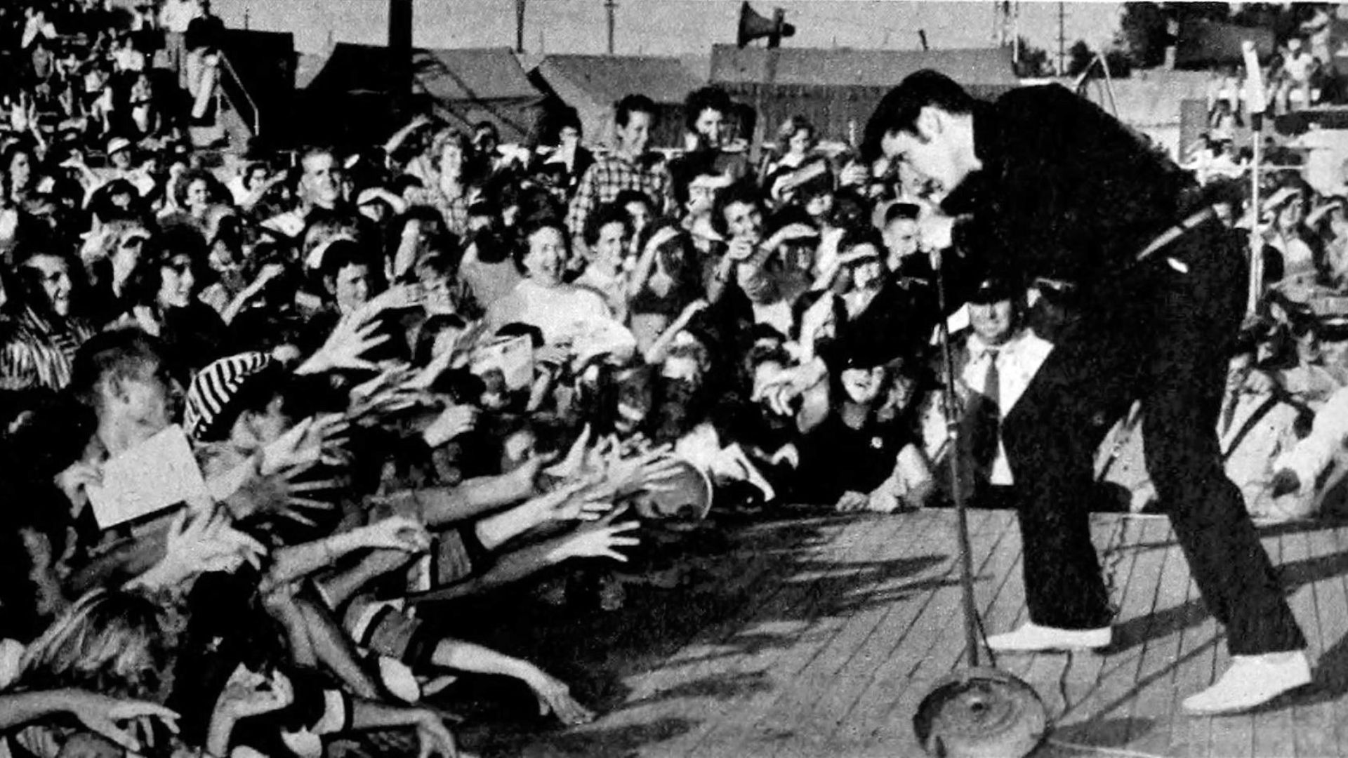Elvis performing live at the Mississippi-Alabama Fairgrounds in Tupelo, Mississippi, September 26, 1956