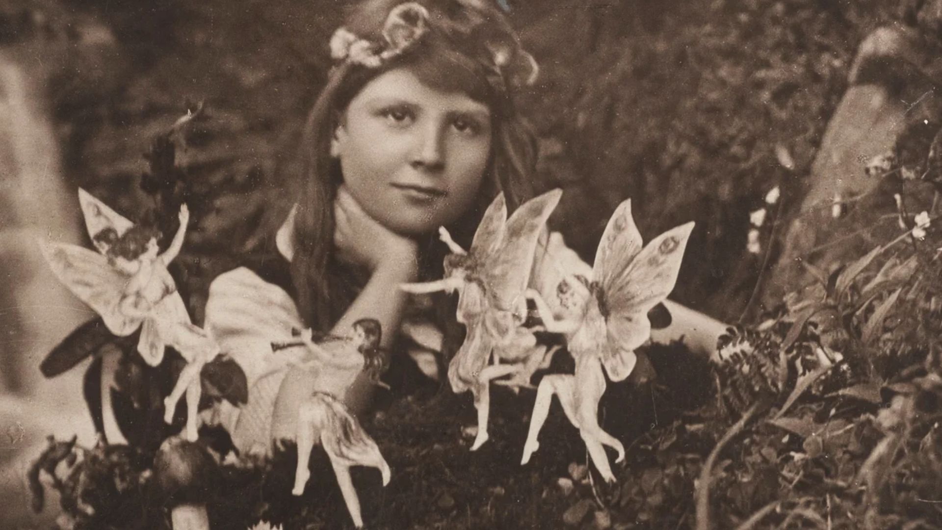 The first of the five photographs, taken by Elsie Wright in 1917, shows Frances Griffiths with the alleged fairies.