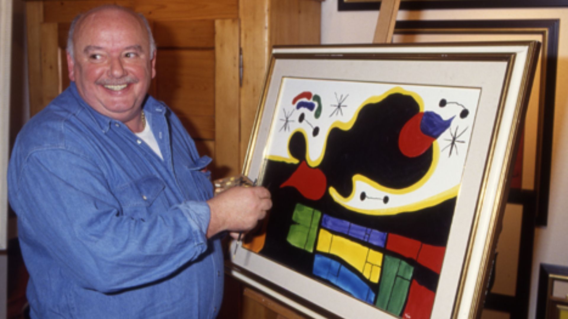Konrad Kujau, author of the Hitler-Diaries, King of Forger and Fright of all Historians, in front of one of his Works. This photo was shot in 1992 in his Galerie in Stuttgart, Germany.