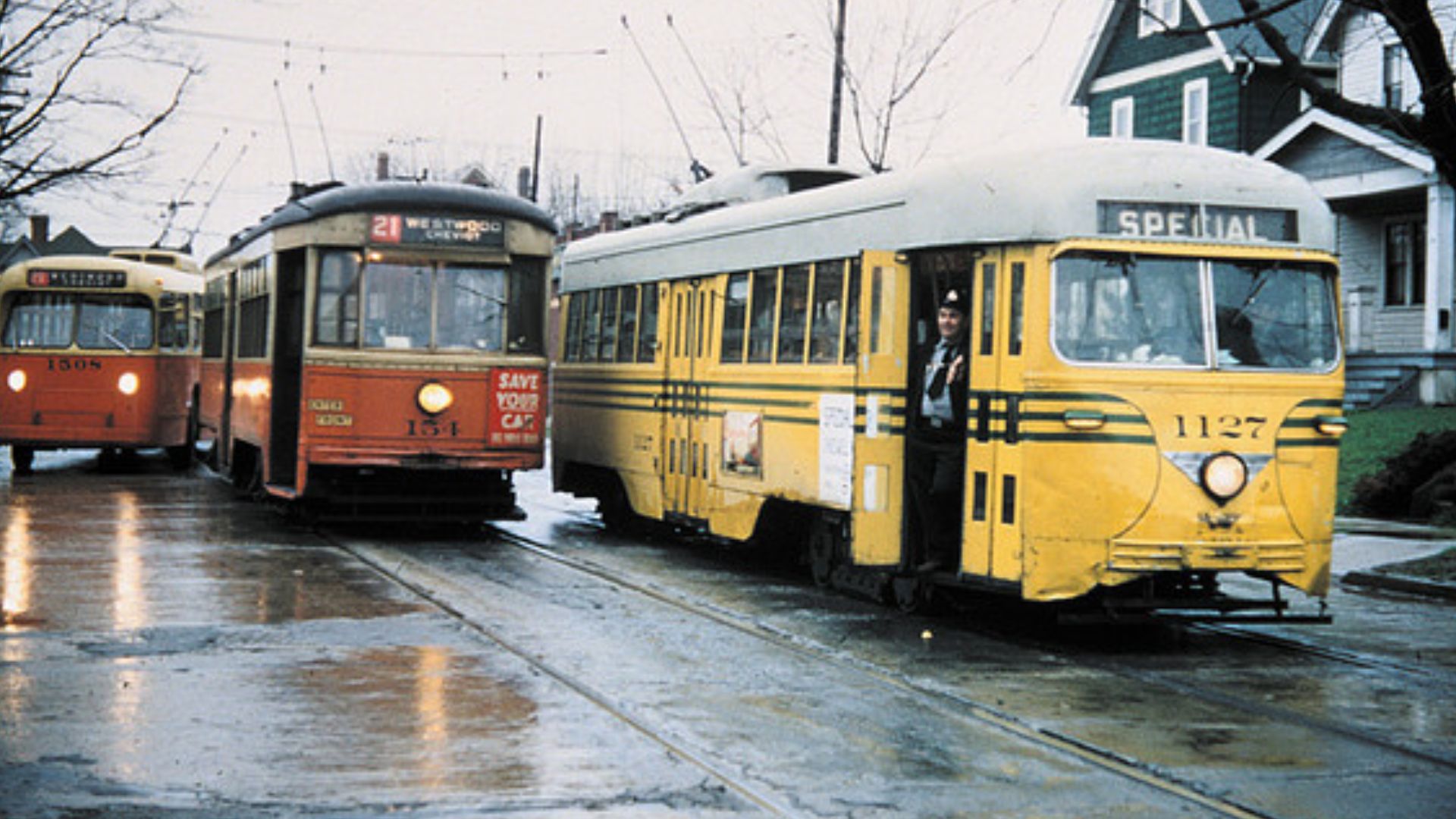One week before the end of streetcar service in Cincinnati, PCC car 1127 and standard car 154 pose for a photo with then-new trolleybus 1508, eastbound on Montana Avenue just east of Glenmore Avenue. The PCC car was on a private excursion.