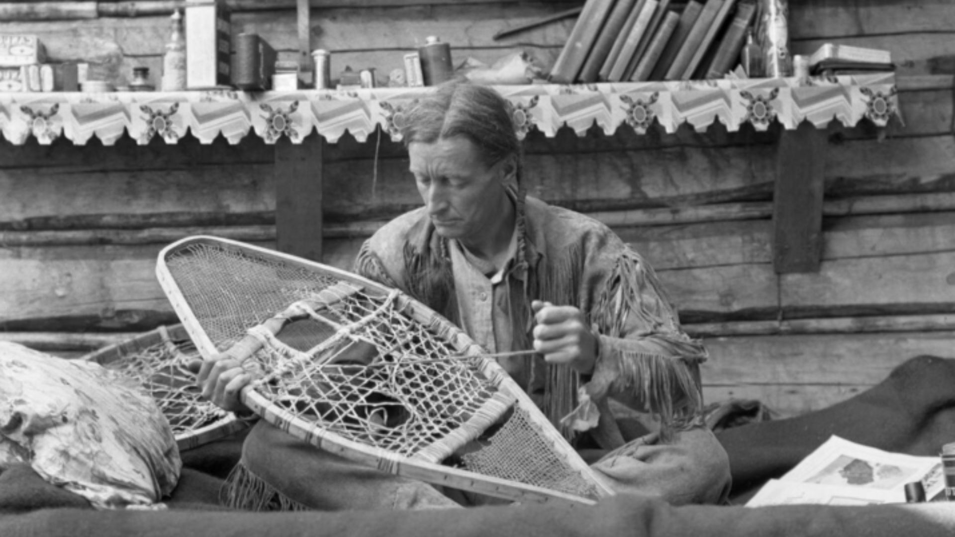 File:Grey Owl mending a snowshoe inside cabin, Lake Ajawaan, Saskatchewan.jpg