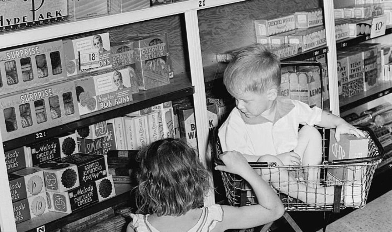 Children shopping in the cooperative store in a model community planned by the Suburban Resettlement Division of the US Resettlement Administration. Greenbelt, Maryland, September 1938.