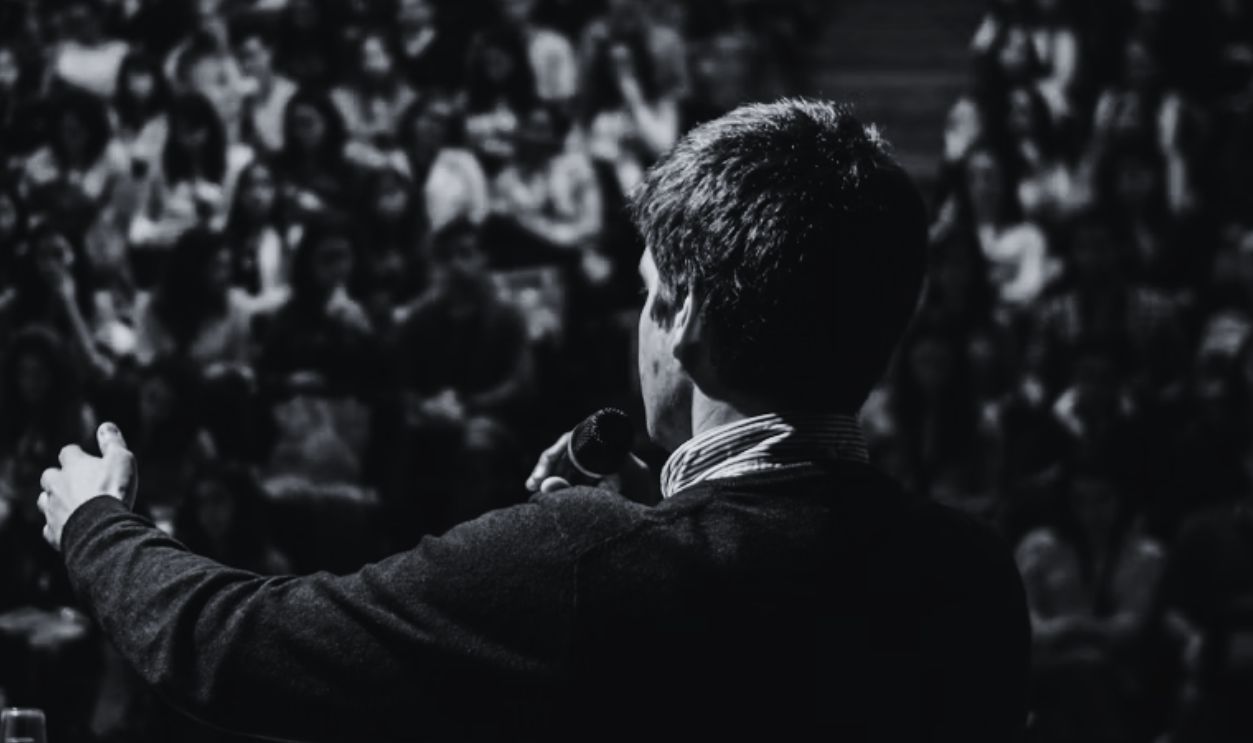 man speaking convention