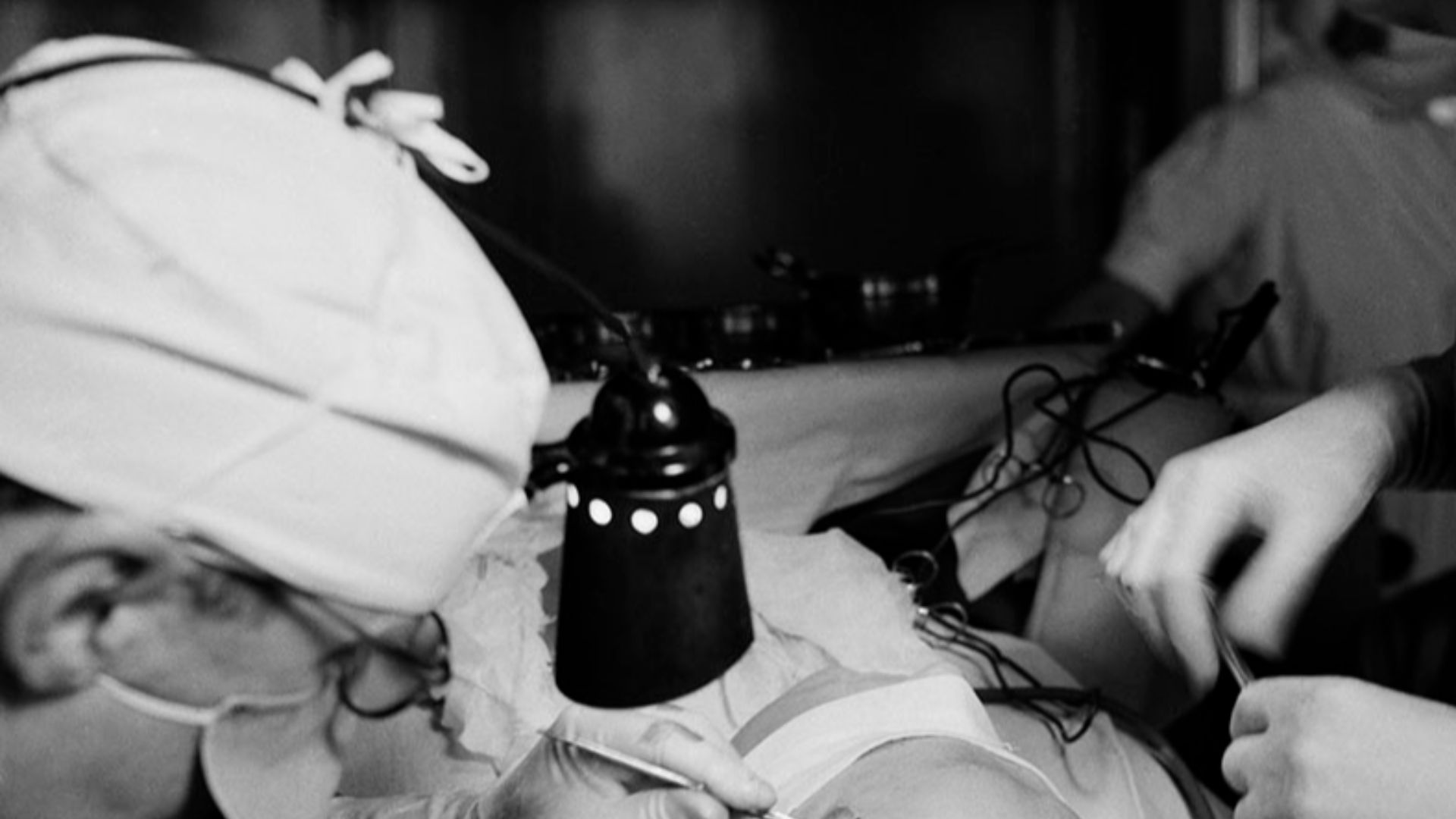 Two doctors perform a lobotomy on an unidentified subject at Södersjukhuset in Stockholm, Sweden. Photo taken by Lennart Nilsson,