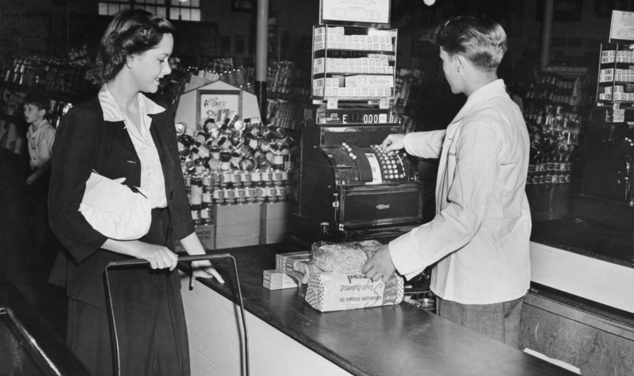 Customer paying cashier at supermarket