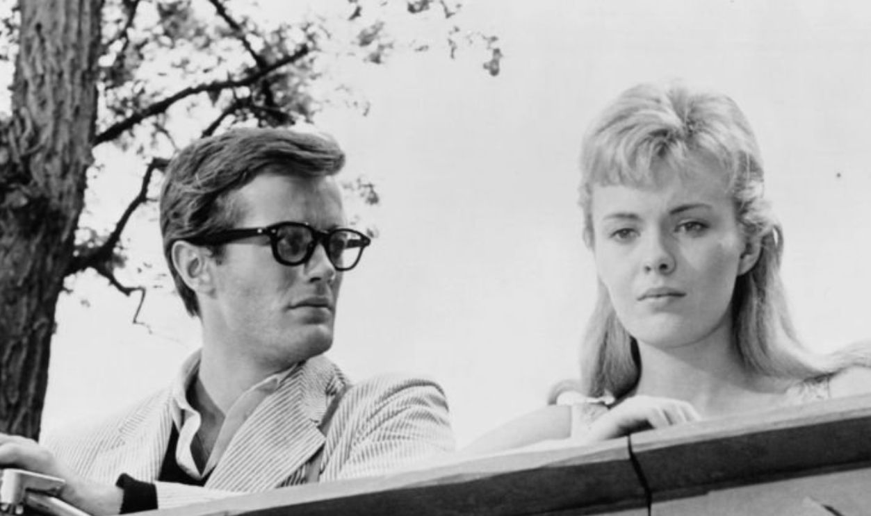 Peter Fonda and Jean Seberg standing at railing in a scene from the film 'Lilith', 1964. 