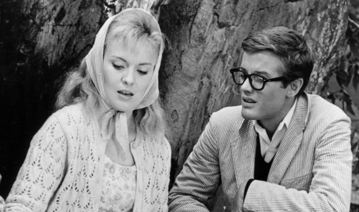 Jean Seberg working on art piece as Peter Fonda watches in a scene from the film 'Lilith', 1964.