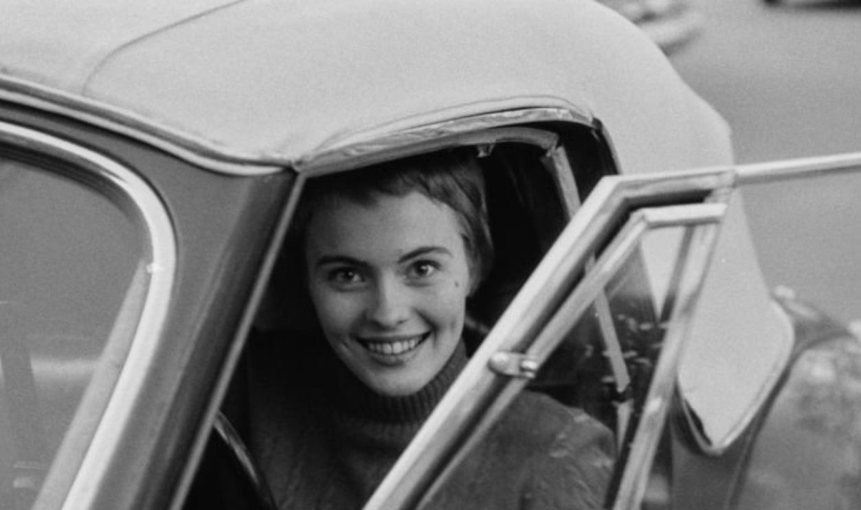 American actress Jean Seberg (1938 - 1979) at the wheel of a sports car in her home town of Marshalltown, Iowa, March 1957. She has just returned to the USA after shooting her debut film, 'Saint Joan' in the UK. She was chosen from eighteen thousand applicants in a nationwide talent search by director Otto Preminger. 