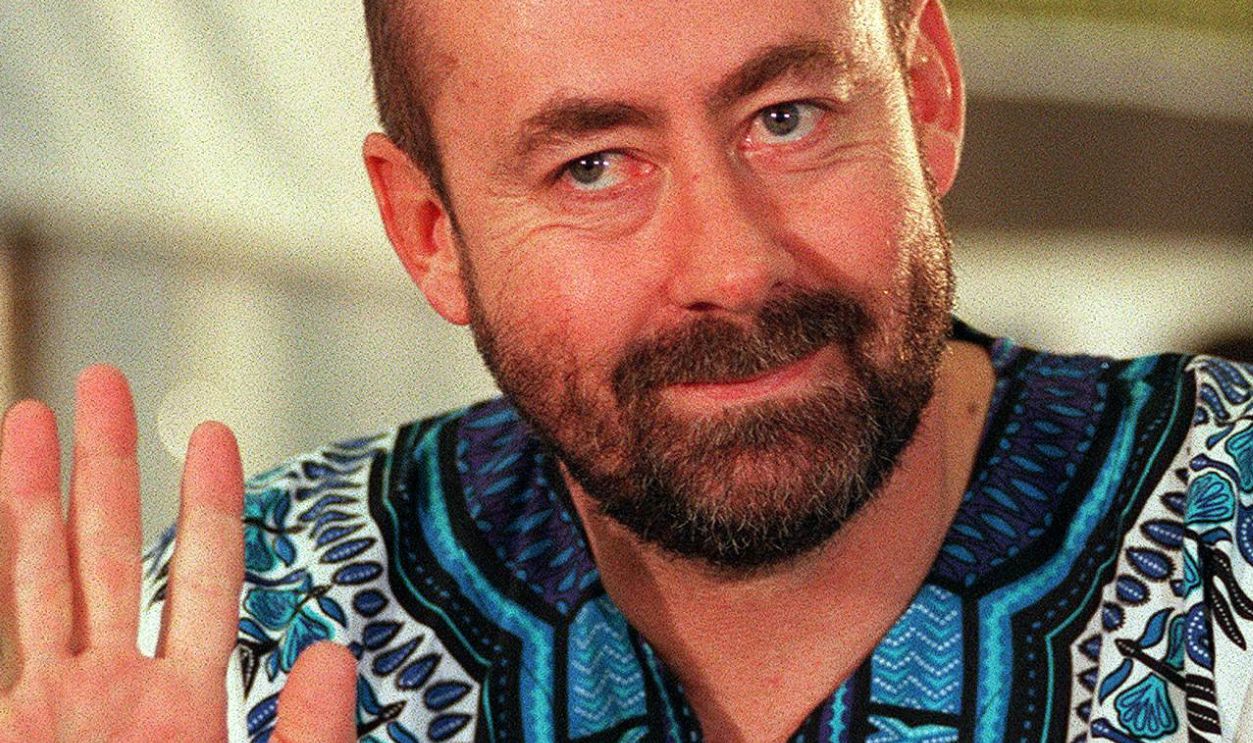 CAPE TOWN, SOUTH AFRICA: Dr Wouter Basson, head of the apartheid-era government's military chemical and biological warfare programme, waves as he arrives at the Truth and Reconciliation Commission (TRC) hearing in Cape Town 10 June. Basson is facing criminal charges relating to the alleged production of the drugs Mandrax and Ecstasy.