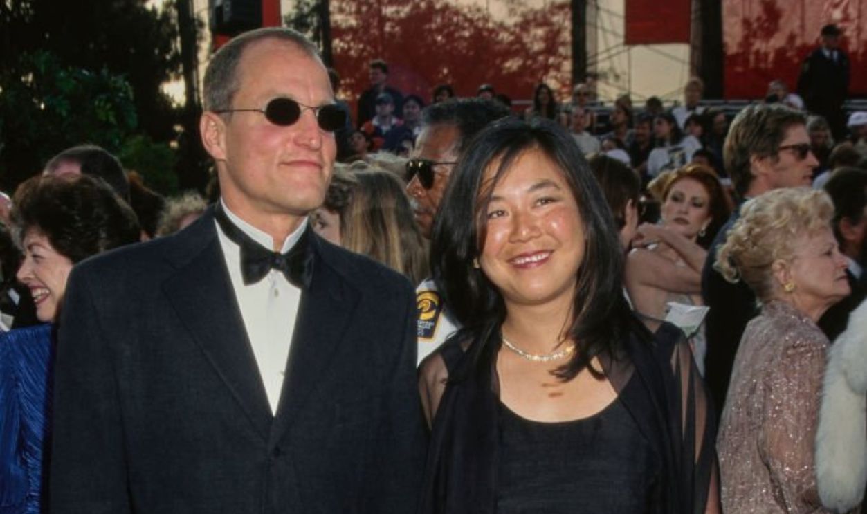 Actor Woody Harrelson with partner Laura Louie on the red carpet at the 69th Annual Academy Awards, Los Angeles, US, 24th March 1997.