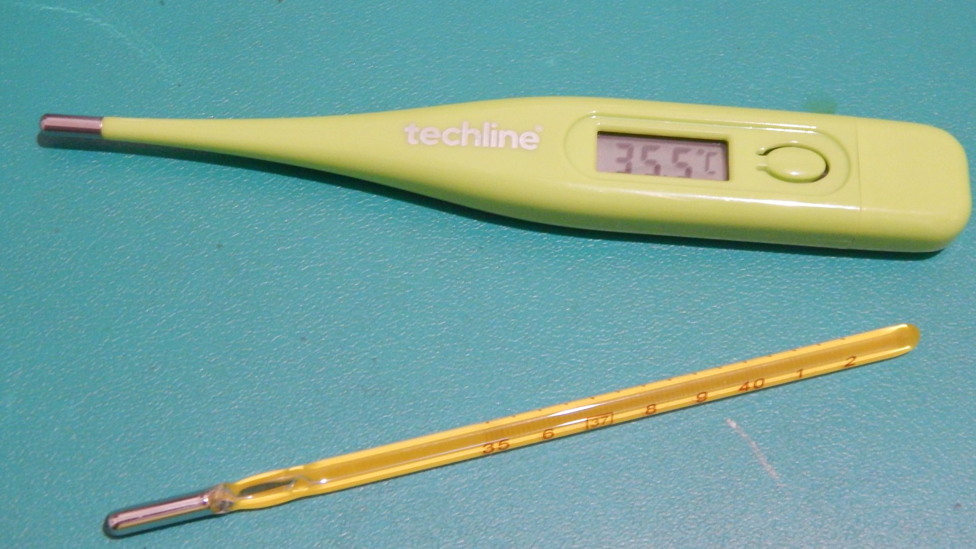 New digital thermometer and old mercury thermometer