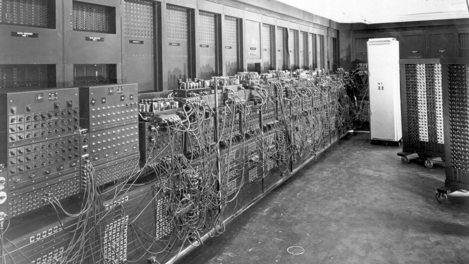 Photo of left side of ENIAC as installed in BRL Bldg 328. The white cabinet in the rear is the core memory, a late addition. 'U.S. Army Photo' from the archives of the ARL Technical Library.