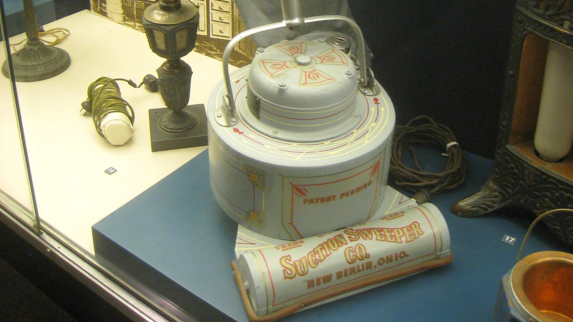 Early electric vacuum cleaner by Electric Suction Sweeper Company, circa 1908, predecessor of Hoover vacuum cleaner (1922). Exhibit in National Museum of American History, Washington, DC, USA.