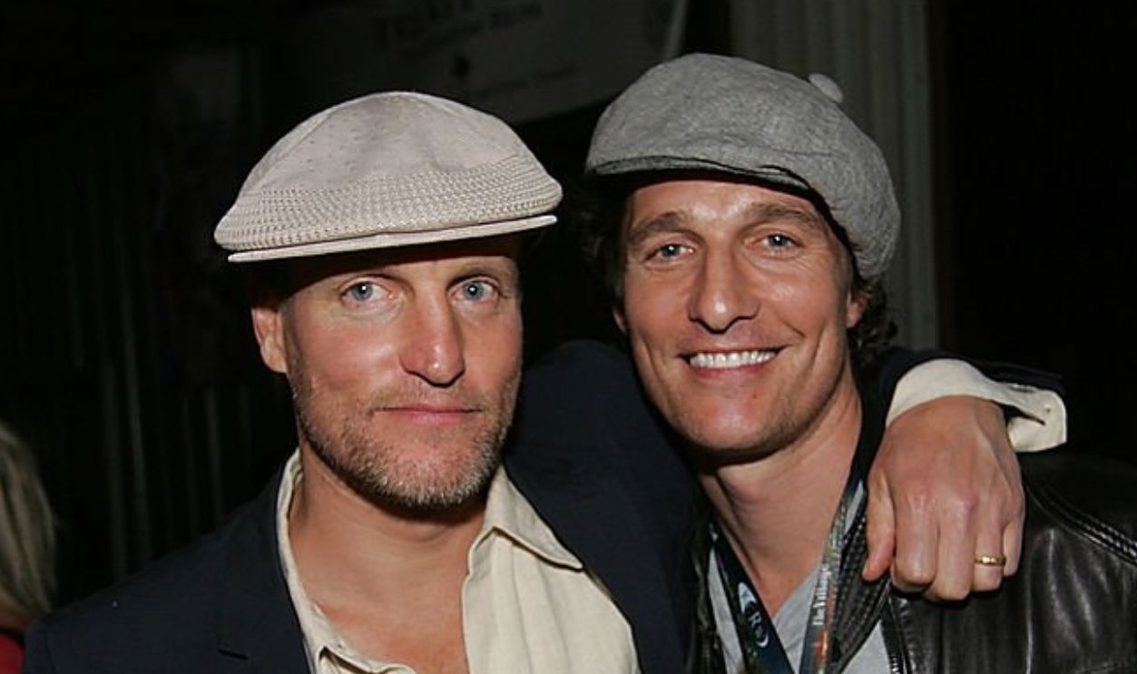 AUSTIN, TX - MARCH 19: Actors Woody Harrelson (L) and Matthew Mcconaughey listen to John Popper perfom at the Bliss Lounge Party benefitting the H.O.P.E. charity at Big Red Sun on March 19, 2010 in Austin, Texas.