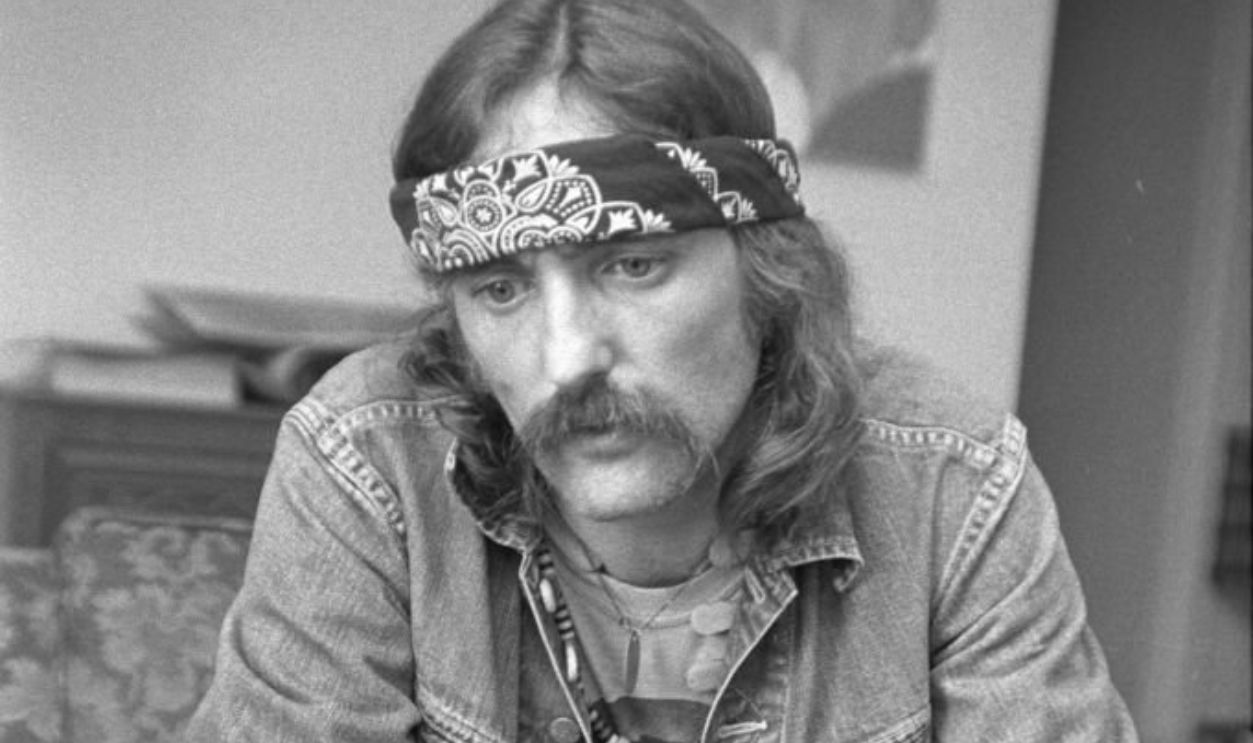 American actor Dennis Hopper wearing a handkerchief bandana, blue jeans, jean jacket and a handlebar mustache 