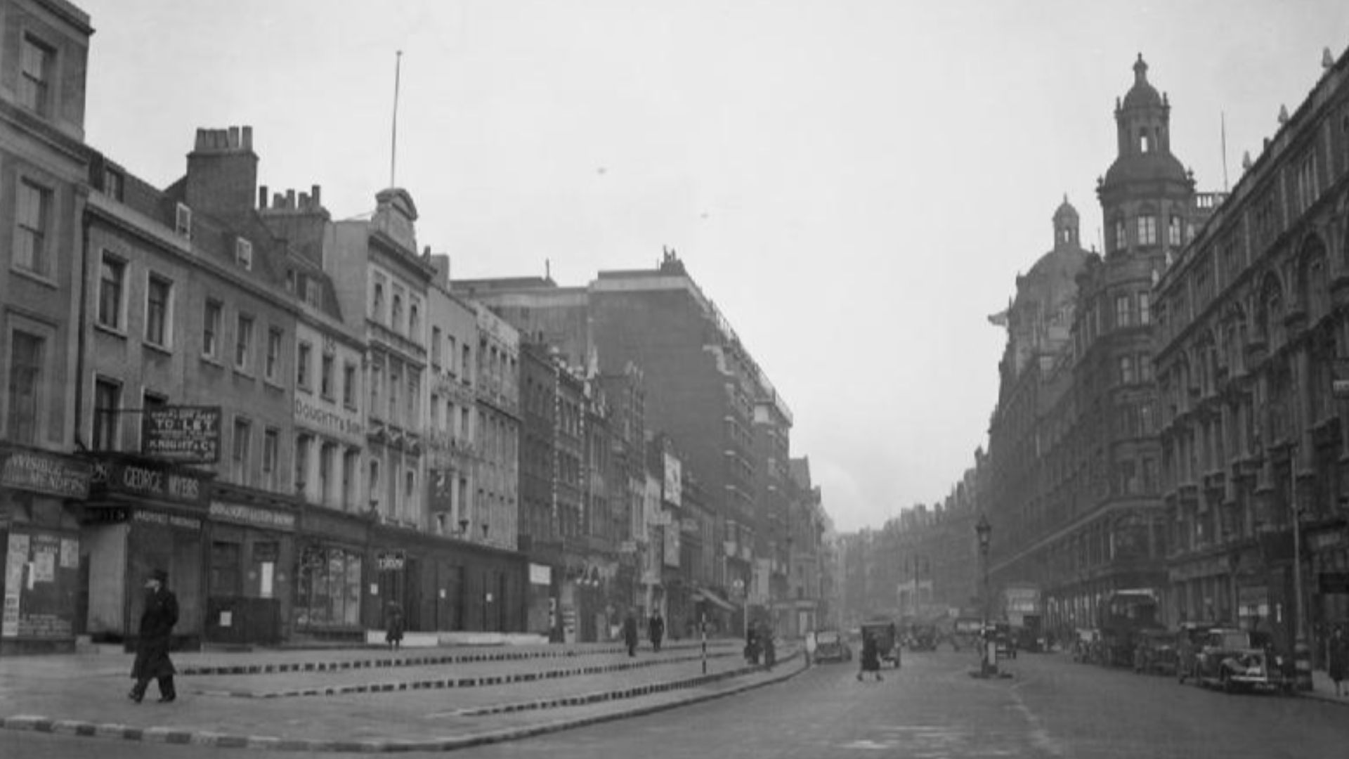 London As USUAL- Everyday Life in London, England, 1940
Pedestrians and vehicles go about their daily business on Brompton Road, London.  This photograph was taken looking towards Knightsbridge, with Harrods visible on the right.  The stepped kerbs visibl