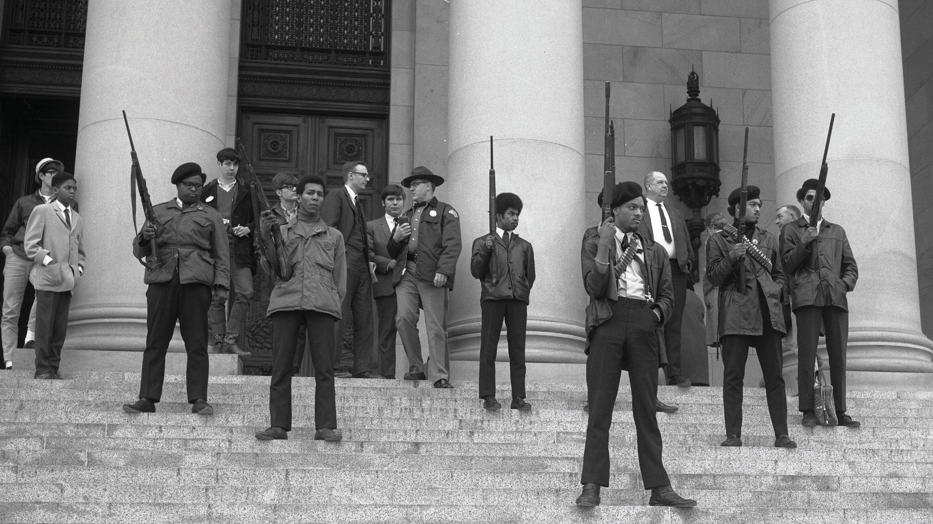 Seattle Black Panther party standing out of the Washington State Capitol building in Olympia, Washington in relation to the gun ban. Photo courtesy of the State Governors’ Negative Collection, 1949-1975, Washington State Archives.