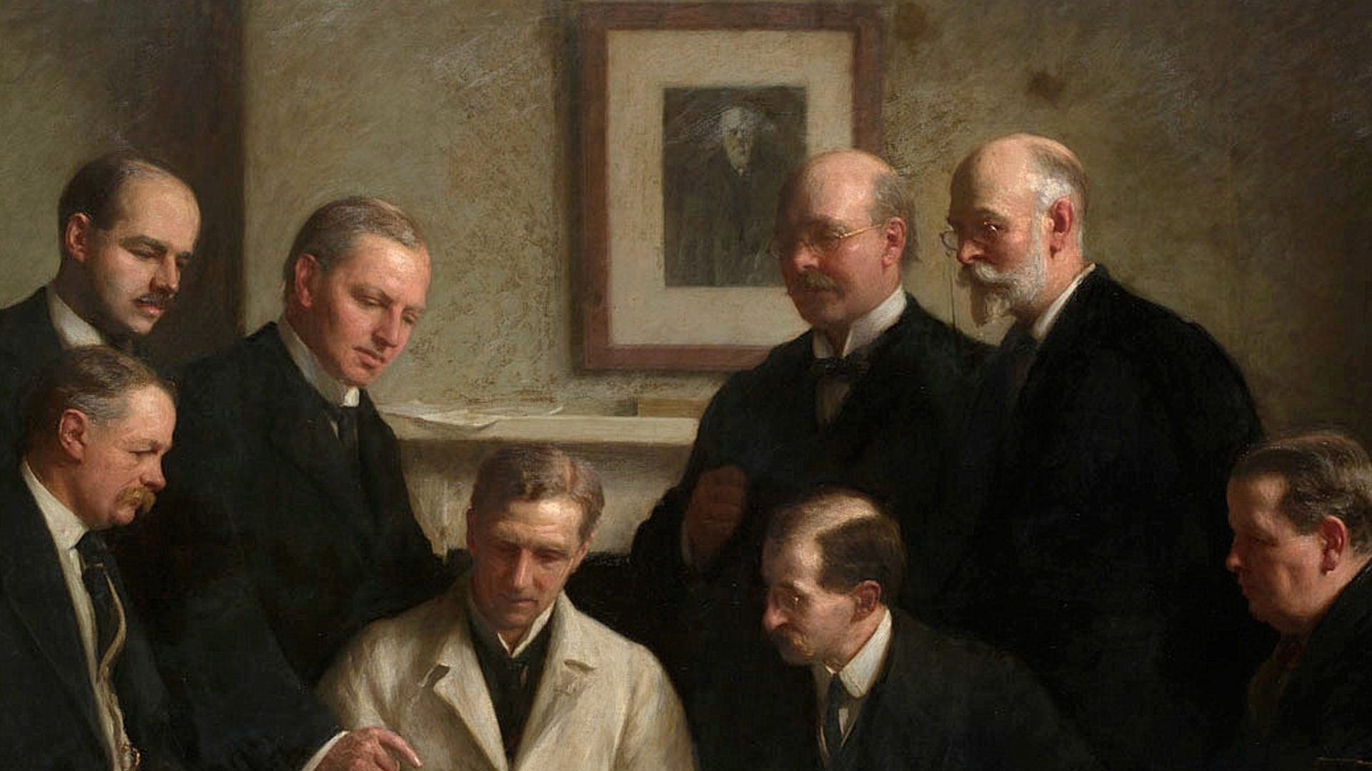 The portrait painted by John Cooke in 1915. Back row: (left to right) F. O. Barlow, G. Elliot Smith, Charles Dawson, Arthur Smith Woodward. Front row: A. S. Underwood, Arthur Keith, W. P. Pycraft, and Sir Ray Lankester. Note the painting of Charles Darwin