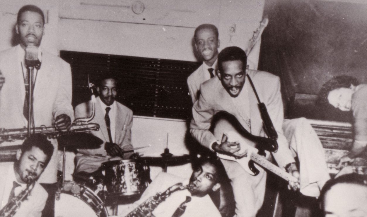 Photo of Ike TURNER; Ike TURNER's Kings Of Rhythm, l to r Billy Gayles (holding bar), Raymond Hill, Eugene Washington (d),Eddie Jones, Ike Turner, Jessie Knight jr., Annie Mae Wilson, 1955, Collection Gilles PTtard