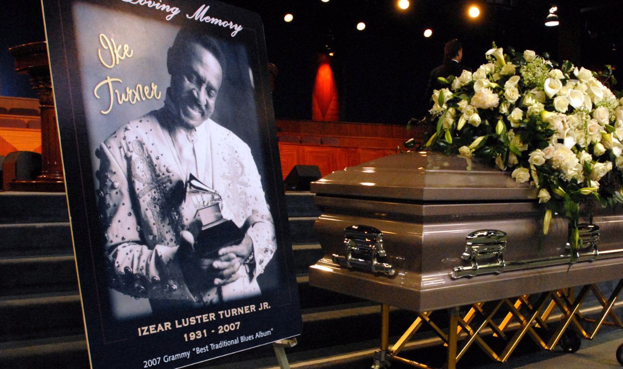 Family and friends gather and pray during a memorial service for singer and musician Ike Turner at the City of Refuge Greater Bethany Community Church, in Gardena
