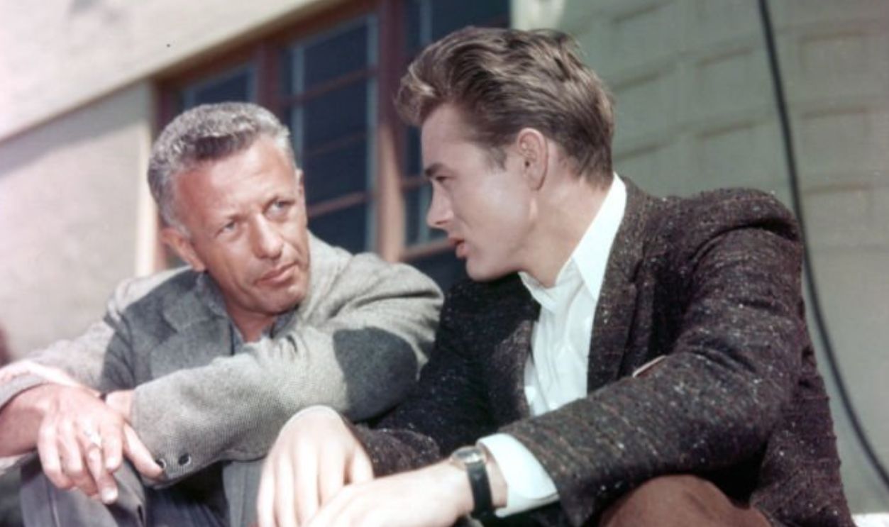 Director Nicholas Ray sits with James Dean on set of the film 'Rebel Without A Cause', 1955. (