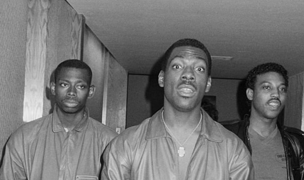 Eddie Murphy next to white man wearing a leather jacket; circa 1970; New York.