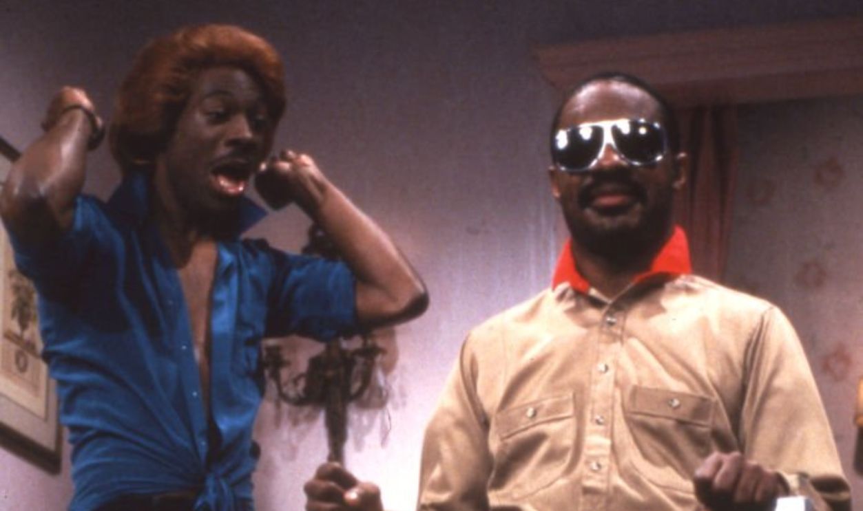 American comedian and actor Eddie Murphy appears on an episode of 'Saturday Night Live' with musician Stevie Wonder, New York, New York, 1983.