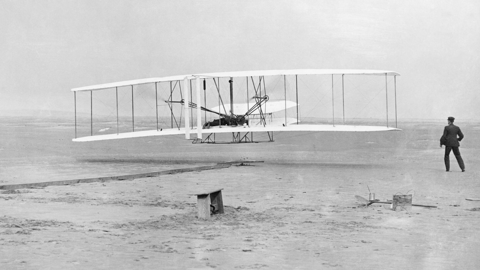 The Wright Brothers
The Wright Flyer airborne during the first powered flight at Kitty Hawk, North Carolina, United States of America, 17 December 1903.  Orville Wright is the pilot while Wilbur Wright runs alongside.