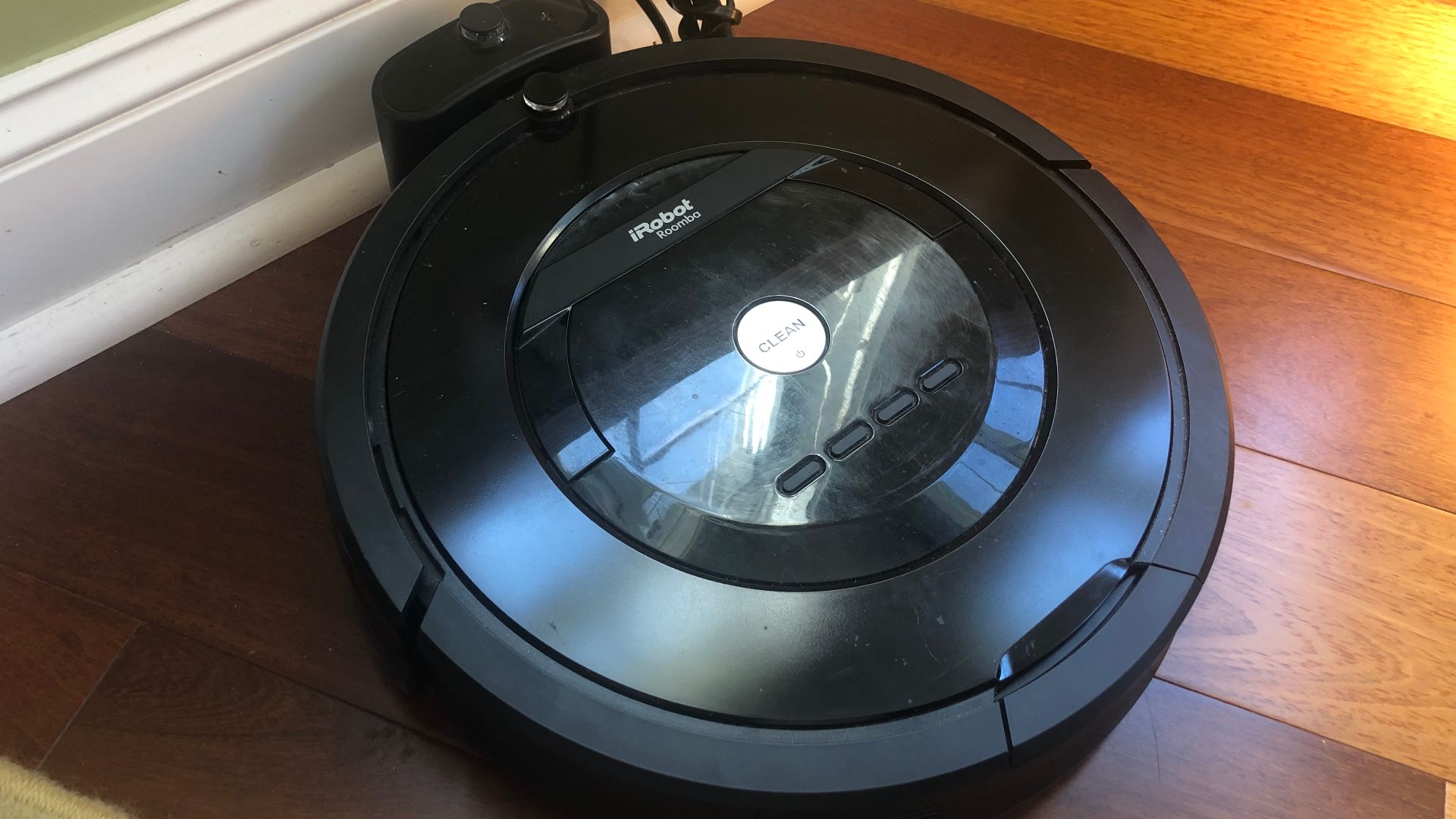 A Roomba 805 on its charging dock.
