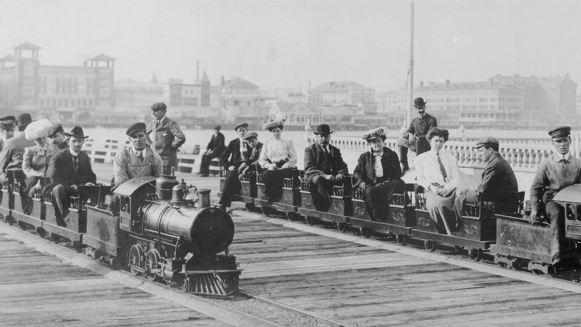 Title: People on two miniature railroad trains on bridge or pier, possibly at Dreamland, Coney Island, New York City
Abstract/medium: 1 photographic print.