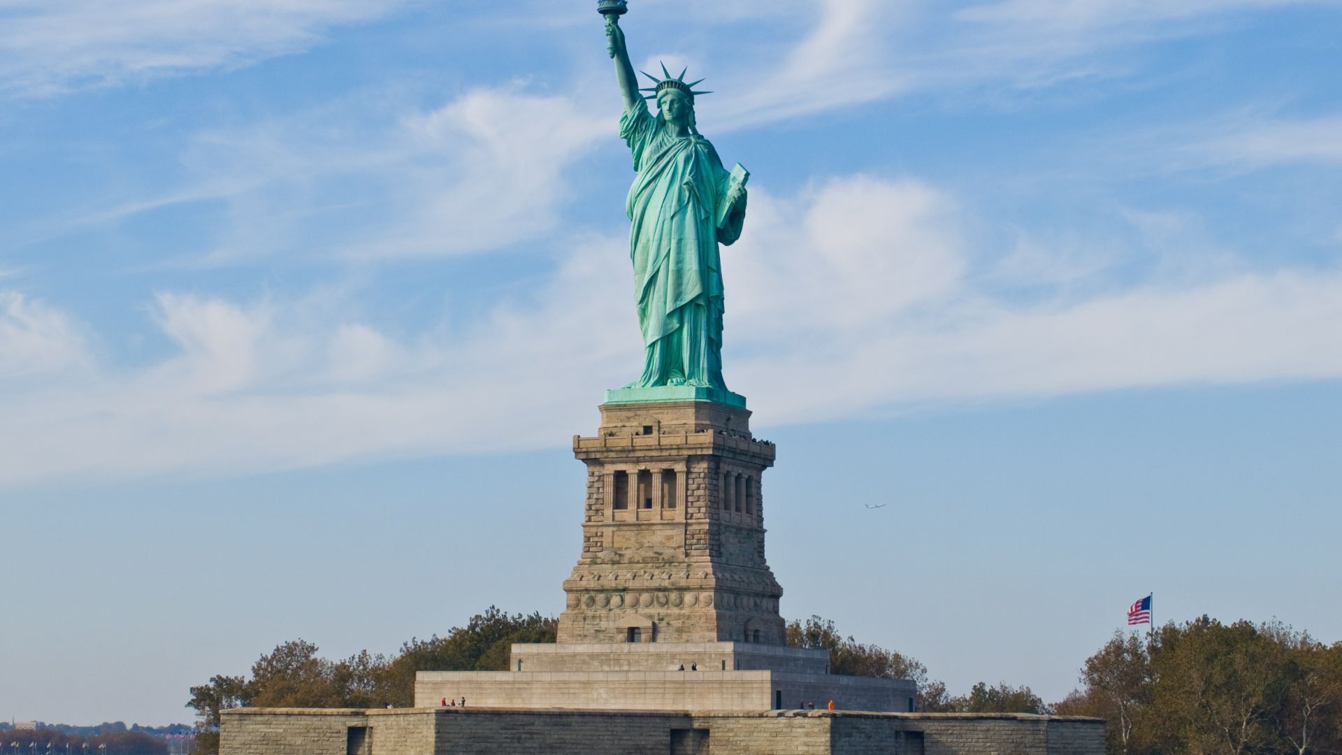 Statue of Liberty (more formally, Liberty Enlightening the World, and more colloquially, Lady Liberty) is a structure located on Liberty Island in New York Harbor, presented to the United States on the centennial of the signing of the American Declaration