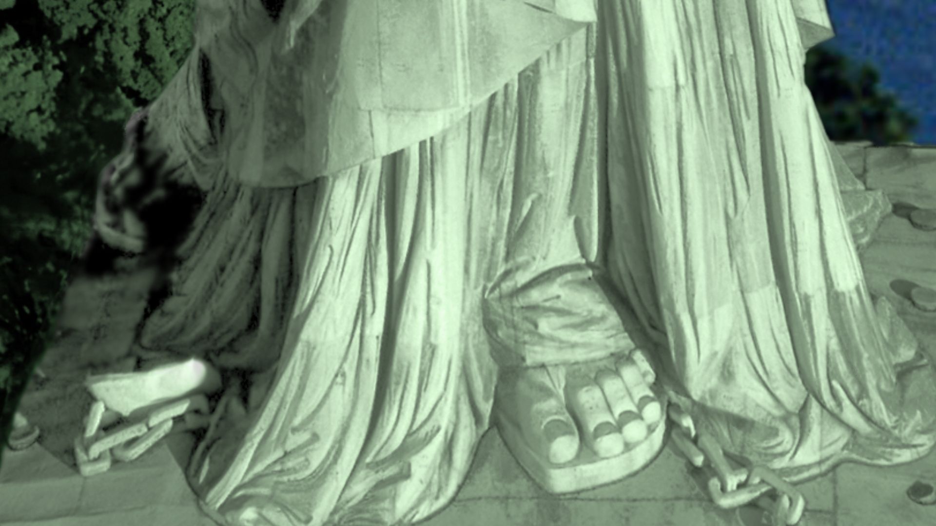 This is a derivative work of the Statue of Liberty's feet on the platform that few get to see except from aerials and drones. It was photographed by the U.S. National Park Service, and the changes in perspective, coloring, and background was the work of B