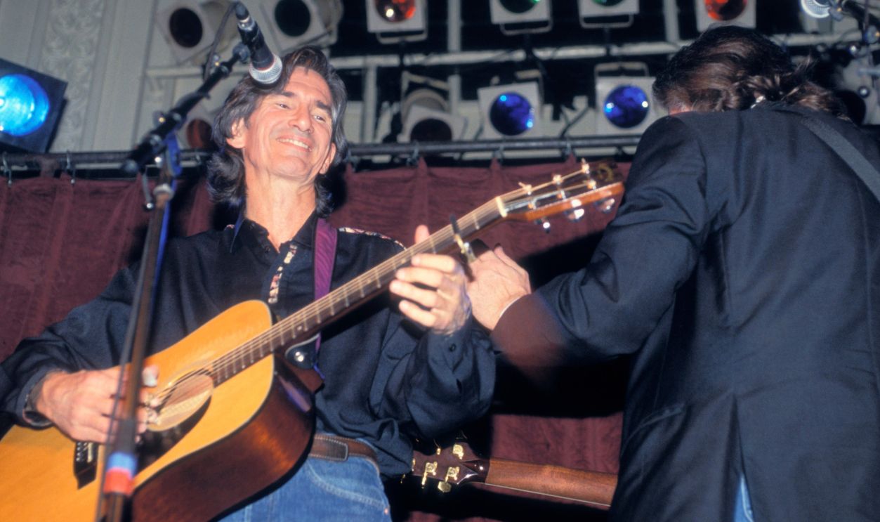 AMSTERDAM, NETHERLANDS - JANUARY 09: American Singer/songwriter Townes van Zandt (1944-1997) on left performs with Guy Clark (right) at Paradiso in Amsterdam, Netherlands on 9th January 1992.