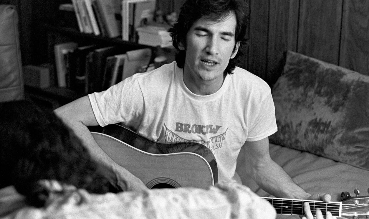 ATHENS, GA. - MAY 20: Singer-songwriter Townes Van Zandt plays his guitar at writer Jim Pettigrew's apartment after performing at The Last Resort on May 20, 1973 in Athens, Georgia.