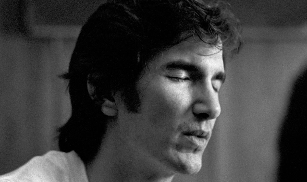 ATHENS, GA. - MAY 20: Singer-songwriter Townes Van Zandt plays his guitar at writer Jim Pettigrew's apartment after performing at The Last Resort on May 20, 1973 in Athens, Georgia.