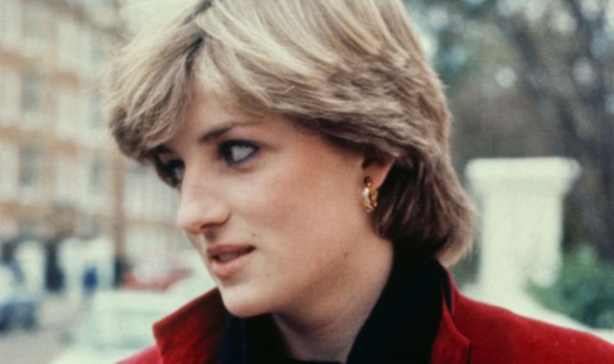 Lady Diana Spencer wearing a red jacket over a black turtleneck sweater, possibly London, England, September 1980. 