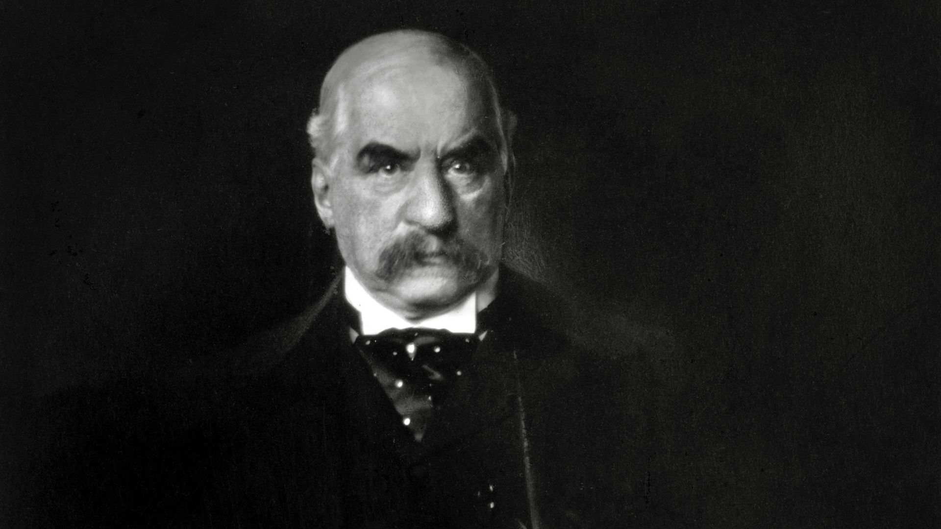 J.P. Morgan photographed by Edward Steichen; photo known for the light reflected off the armrest being interpreted by viewers as a knife.