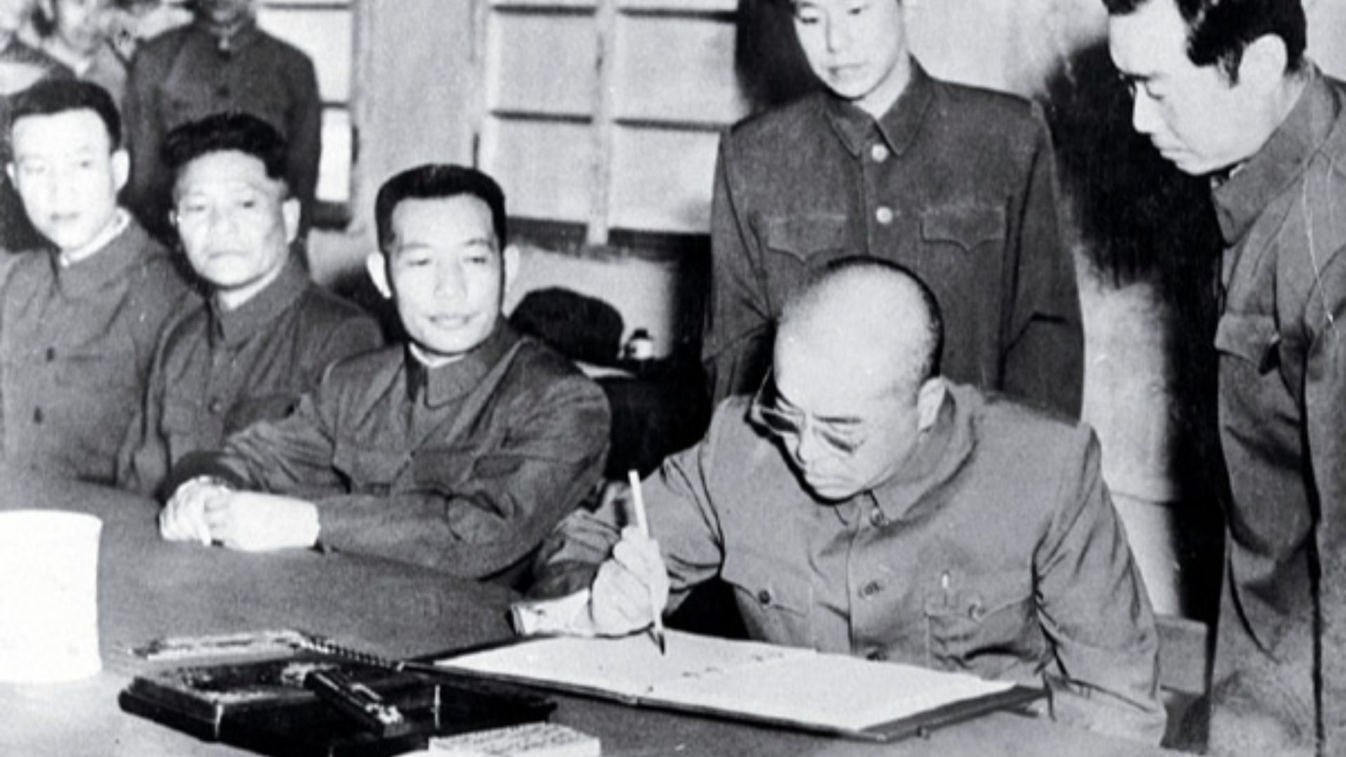 The Chinese general, Peng Dehuai, signs the 1953 armistace agreement ending the Korean War, in Kaesong.