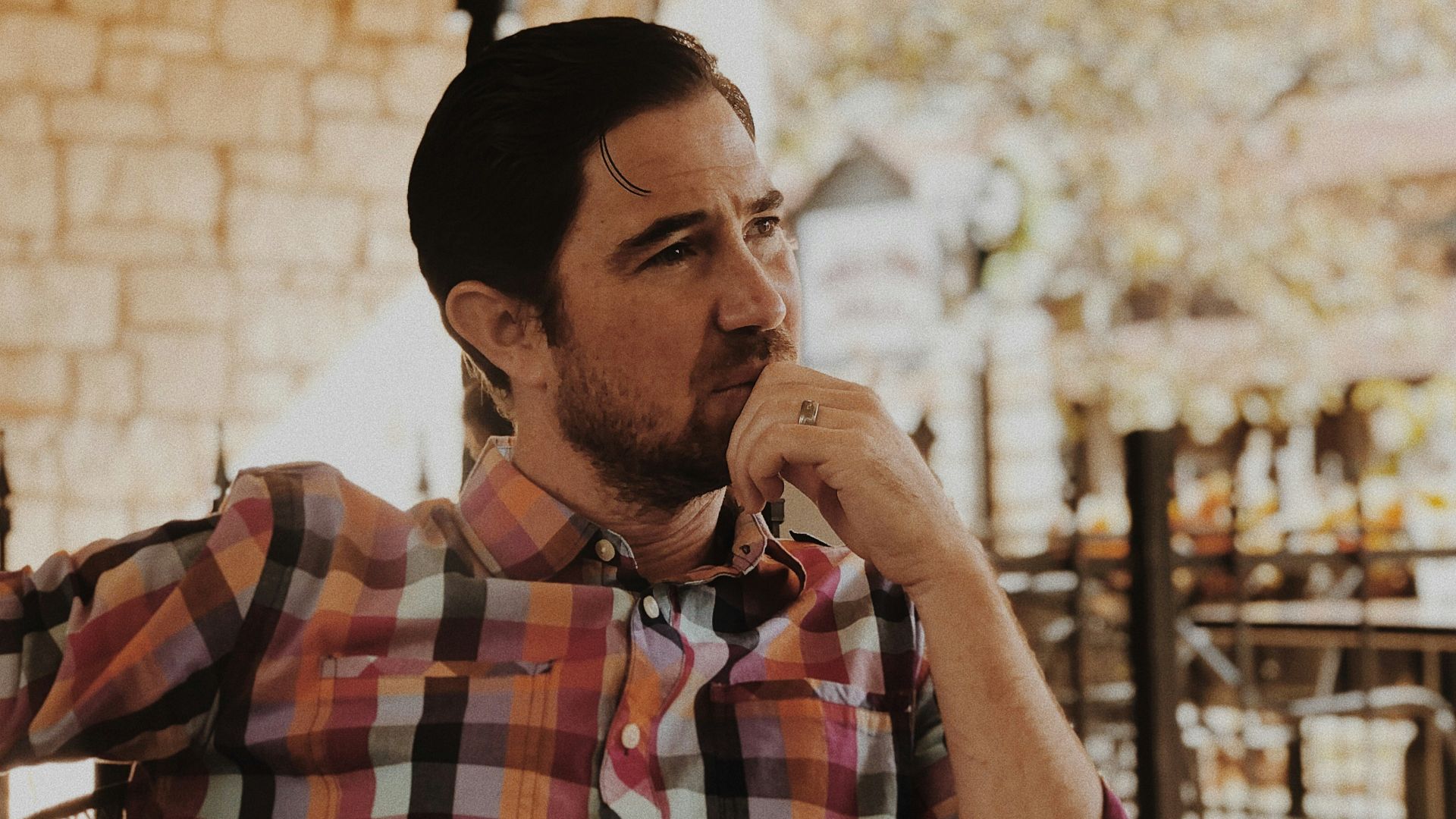 man in red and black plaid dress shirt