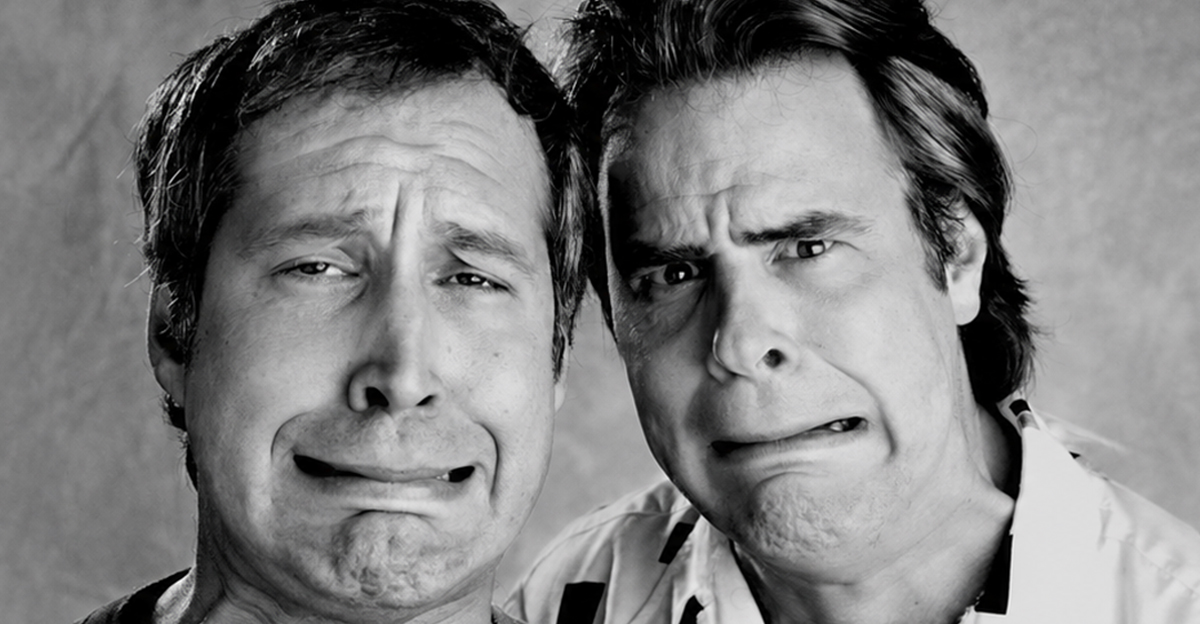 Chevy Chase and Dan Aykroyd comically grimace at the camera in Los Angeles in February of 1986