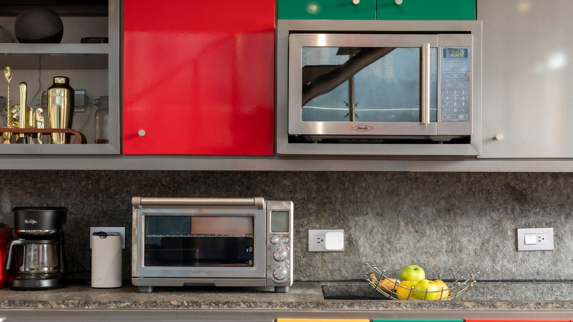 silver microwave oven on black marble counter top