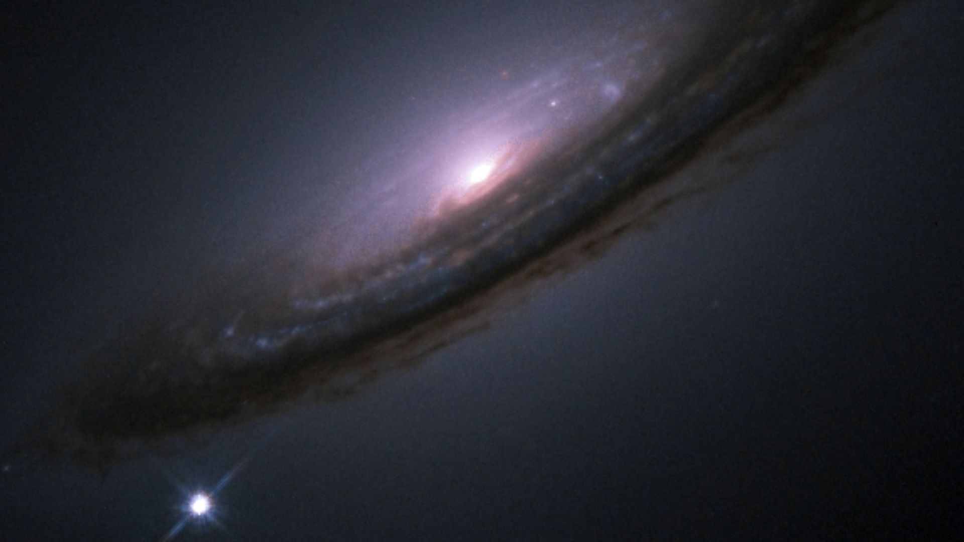 Hubble Space Telescope-Image of Supernova 1994D (SN1994D) in galaxy NGC 4526
(SN 1994D is the bright spot on the lower left)