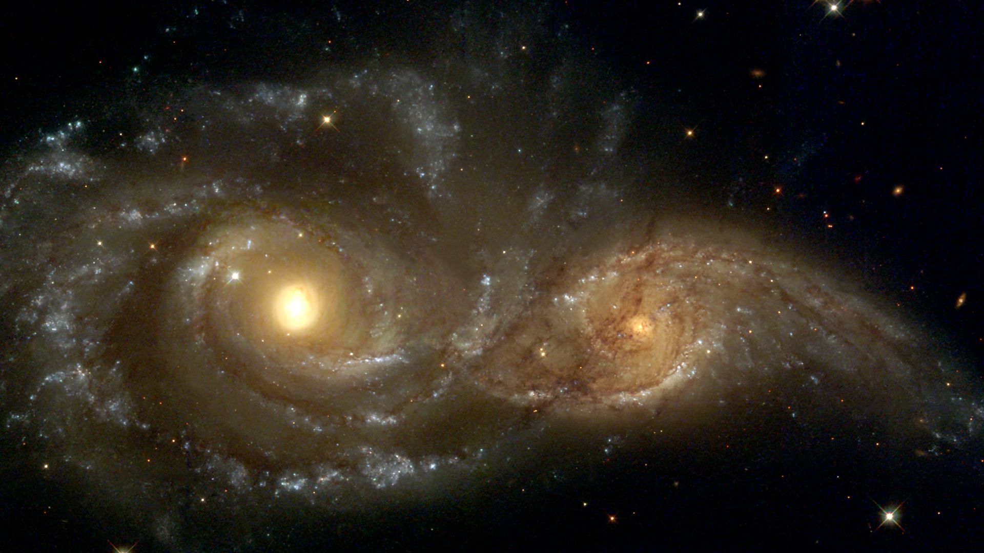 Near colliding NGC 2207 and IC 2163 as seen by the NASA/ESA Hubble Space Telescope.