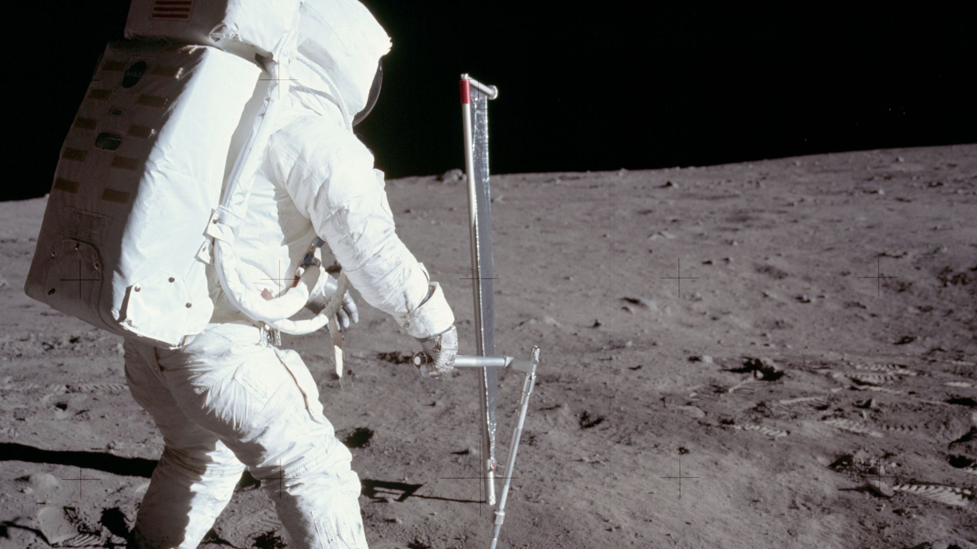 Apollo 11 Hasselblad image from film magazine 40/S - EVA.  Aldrin collecting Lunar drive tube 10005.
This photo was used in Figure 1-34 in the Apollo 11 Preliminary Science Report (NASA SP-214), 1969, which has the following caption:

The astronaut is col