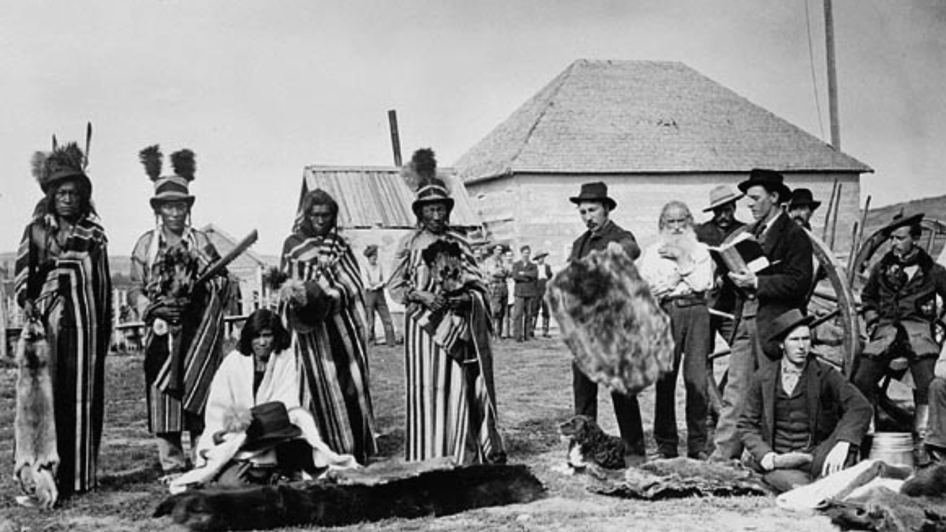 Title / Titre :Mistahi maskwa (Big Bear, lived ca. 1825-1888), (standing forth from left) a plains Cree chief trading at Fort Pitt, Northwest Territories, 1884 / Mistahi maskwa (Big Bear, vers 1825-1888), (4e à partir de la gauche) un chef cri des Plaines