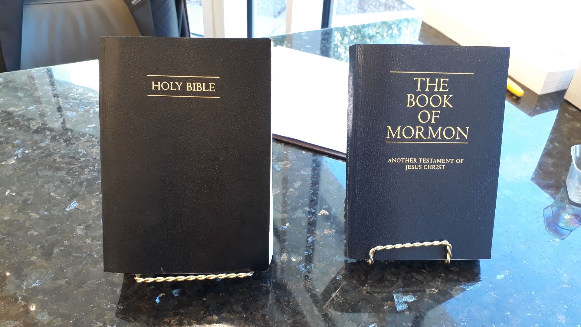 The Holy Bible and The Book of Mormon on display in the St. George Temple Visitors' Center in St. George, Utah.