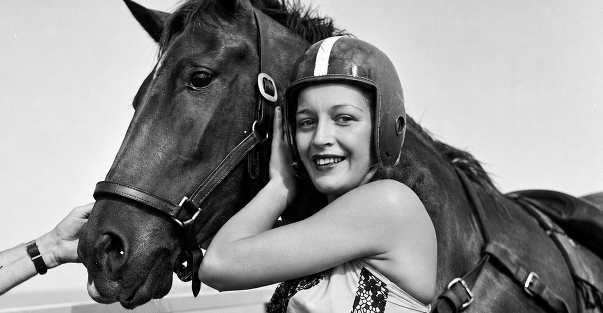 circa 1955: Dinah, a diving horse stands with her rider just after a dive
